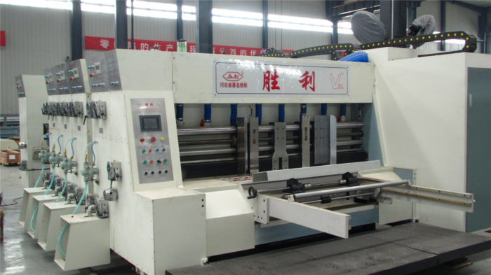 Automatic lead edge sheet feeder for corrugated box making machine